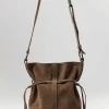 Corîu Suede Small Bucket Crossbody Bag In Taupe